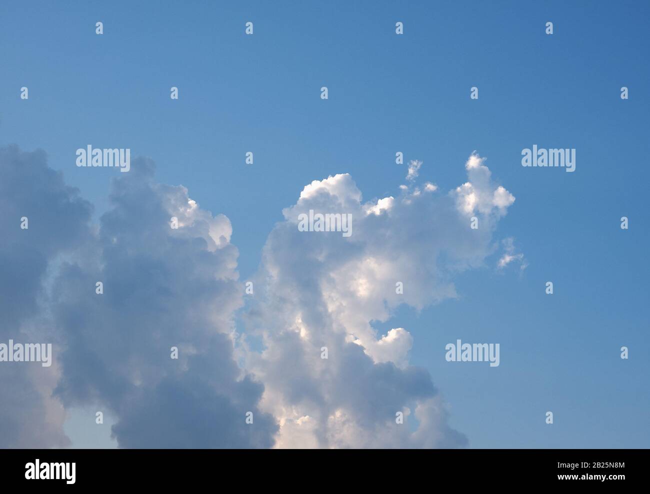 blue sky with clouds useful as a background Stock Photo - Alamy