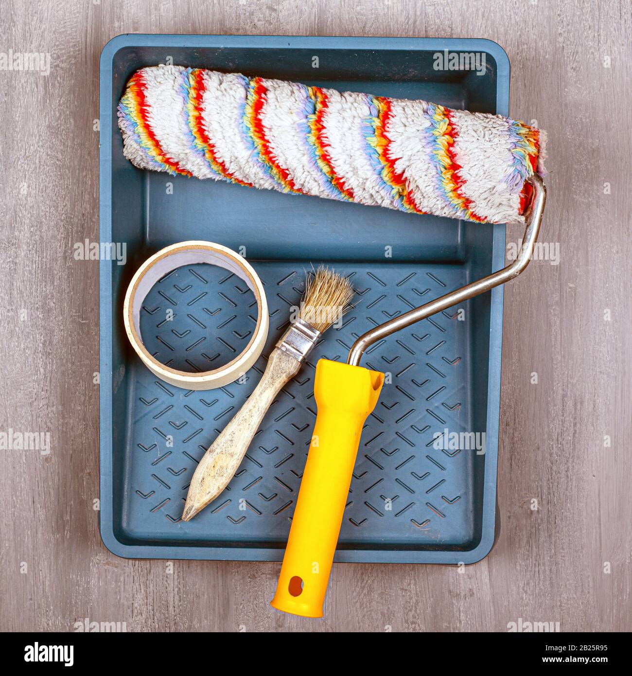 painting work concept. set of tools for painting and repairing walls. roller and brush Stock