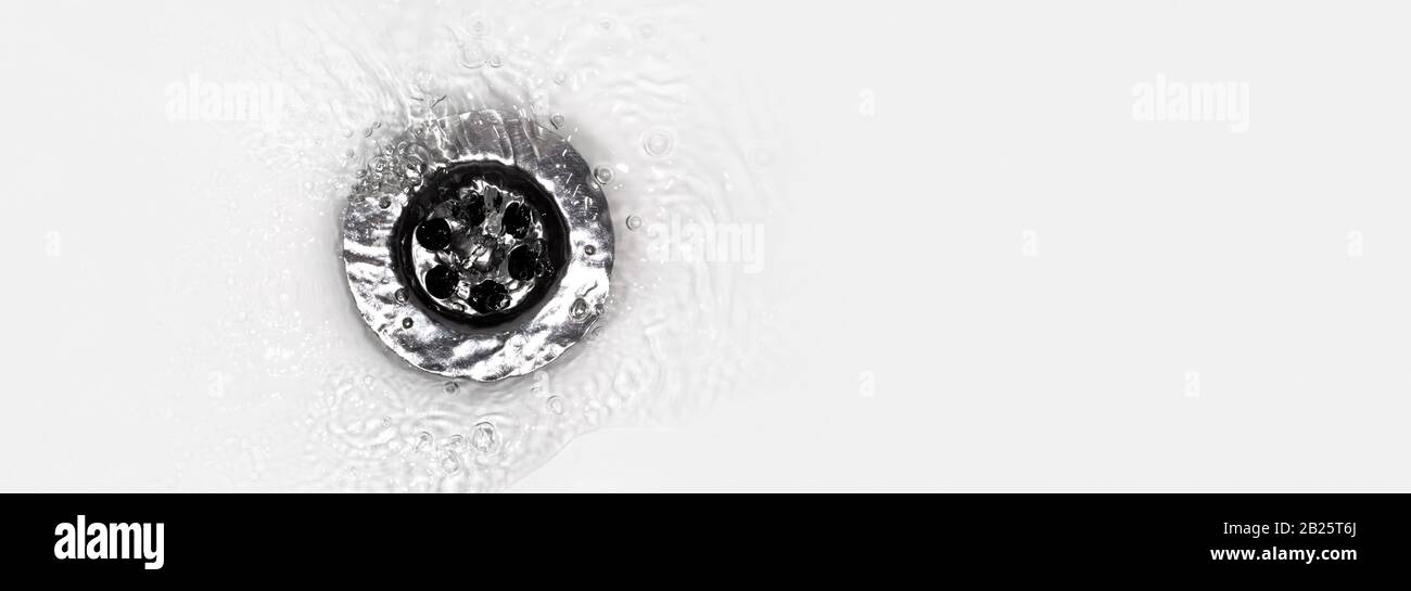 water flows into a sink in a white sink, a closeup photo, panoramic
