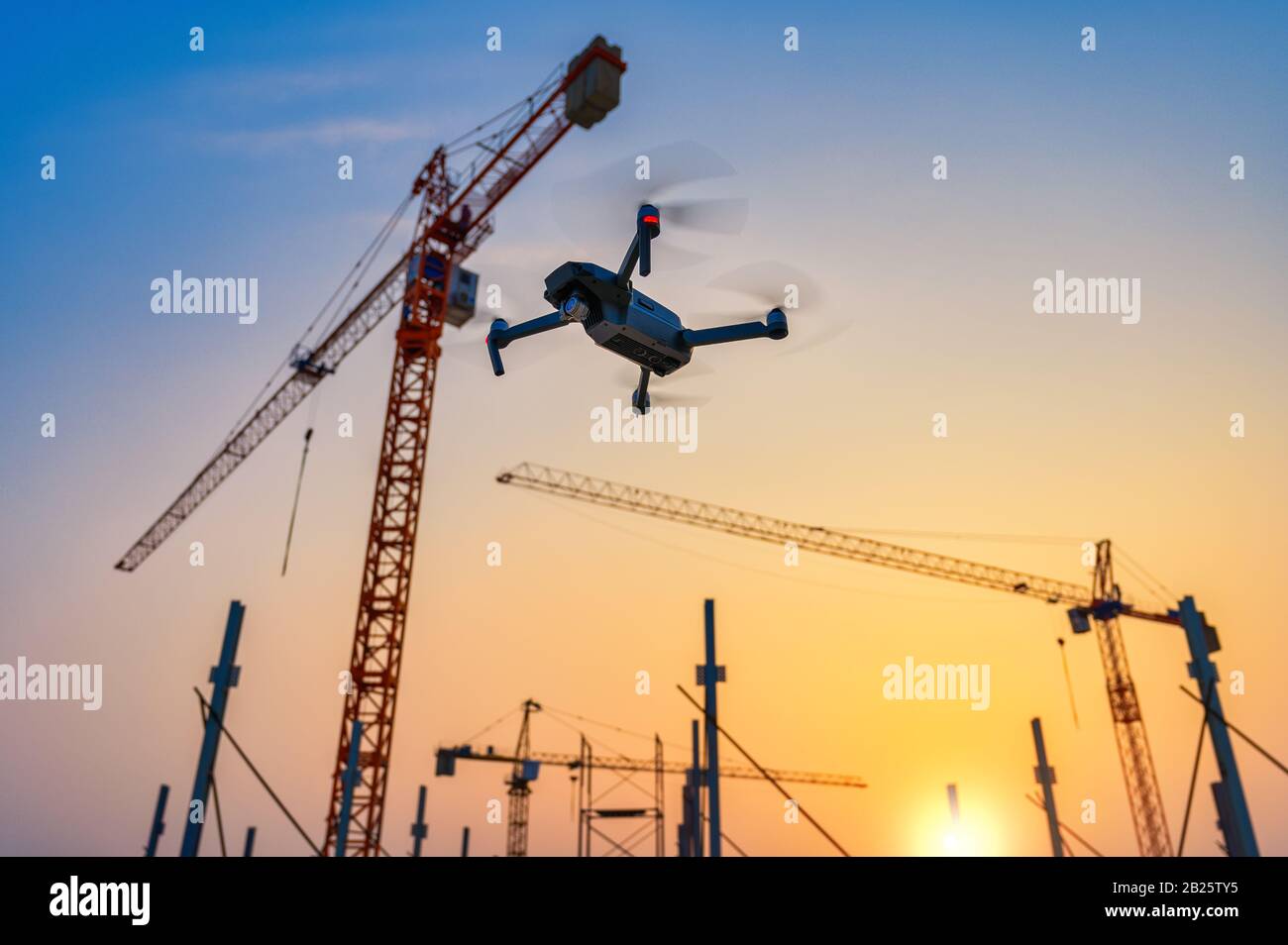 Drone over construction site. video surveillance or industrial