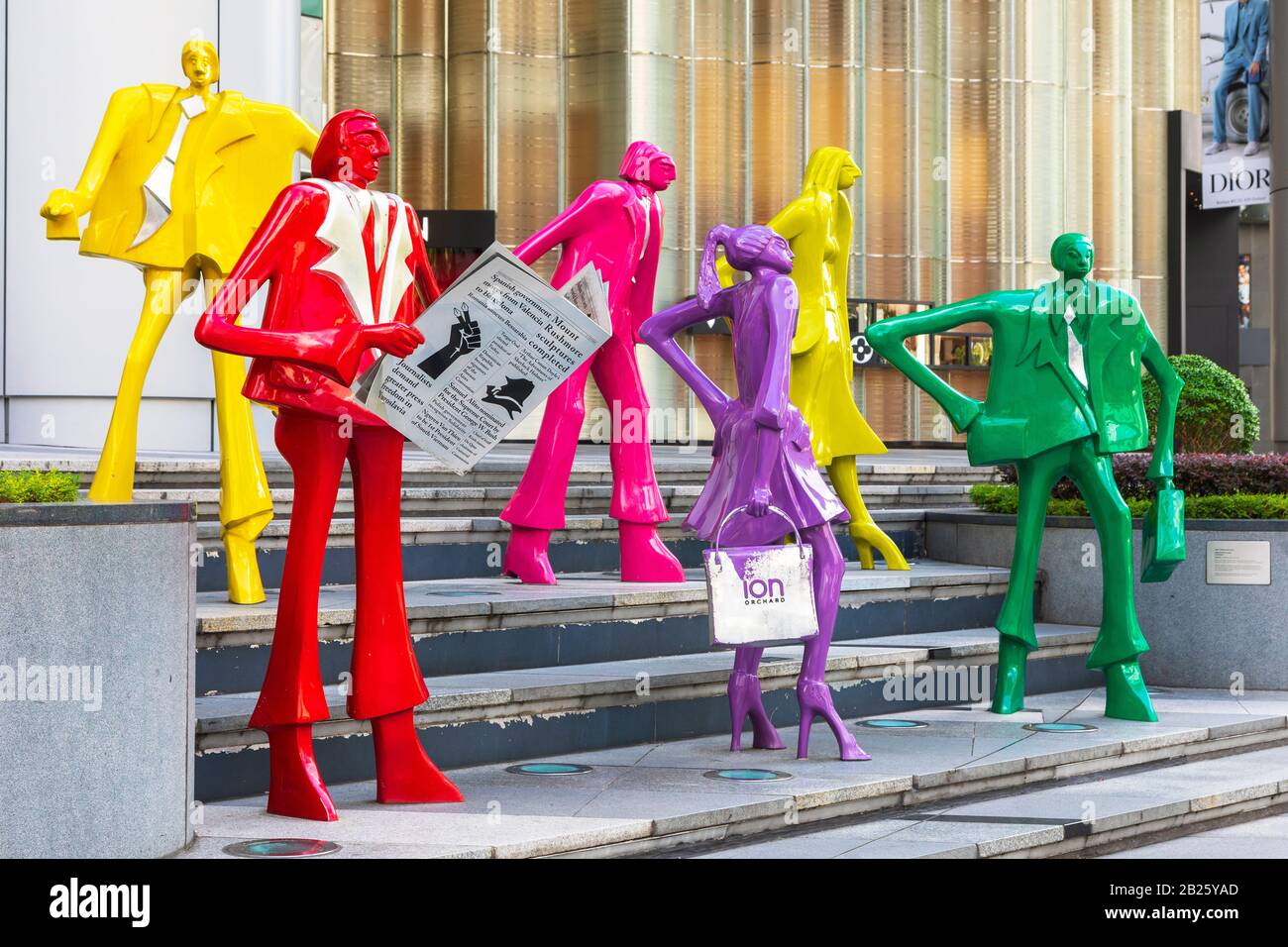 Artistic statues representing shoppers on the steps outside the famous shopping mall ION, on Orchard Road, Singapore, Asia Stock Photo