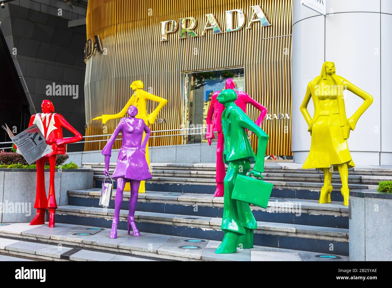 Artistic statues representing shoppers on the steps outside the famous shopping mall ION, on Orchard Road, Singapore, Asia Stock Photo