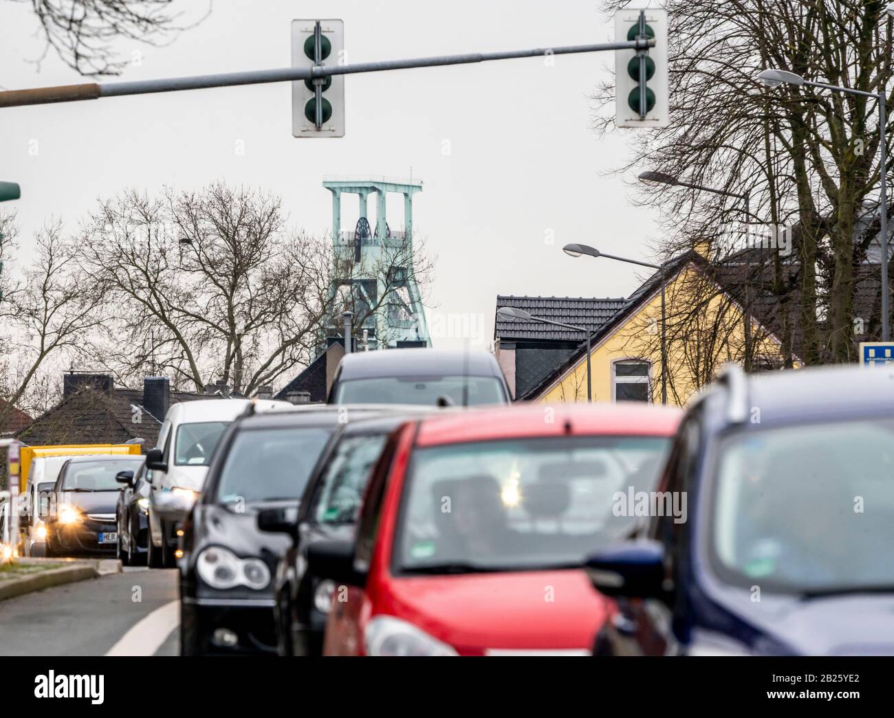 Dense traffic on the Herner Stra§e, in Bochum Riemke, winding tower of the mining museum, Germany Stock Photo