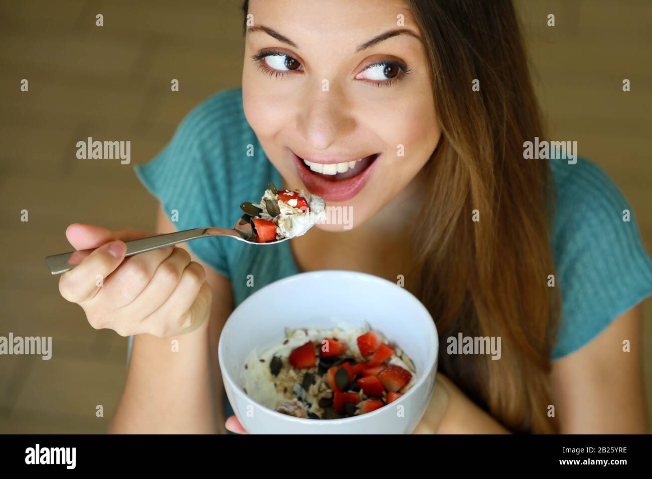 Young woman eating yogurt model hires stock photography and images Alamy