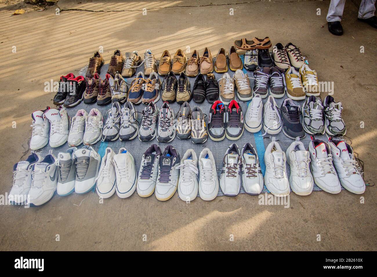 Used shoes for sale on a street in Lagos, Nigeria. Stock Photo
