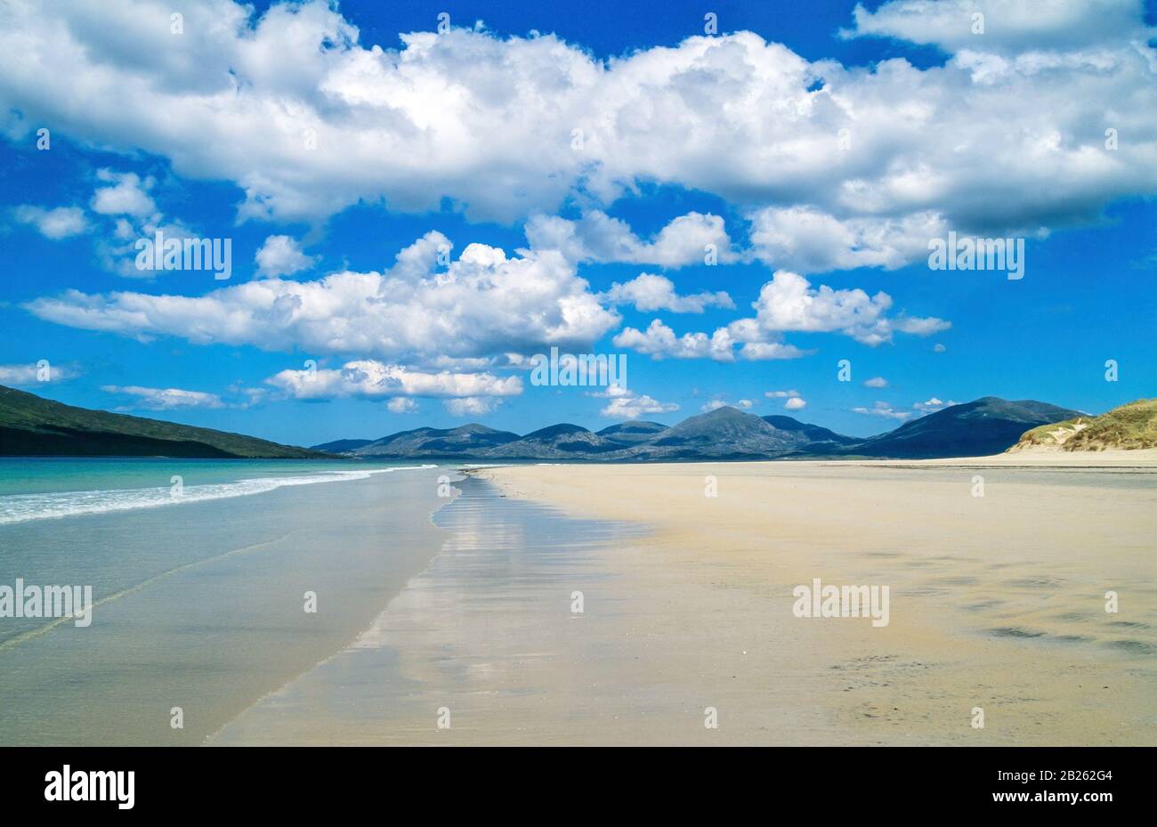 Expanse of smooth sand at Luskentyre (Losgaintir) Beach on a beautiful Summer day in June with blue sky, Isle of Harris, Scotland, UK Stock Photo