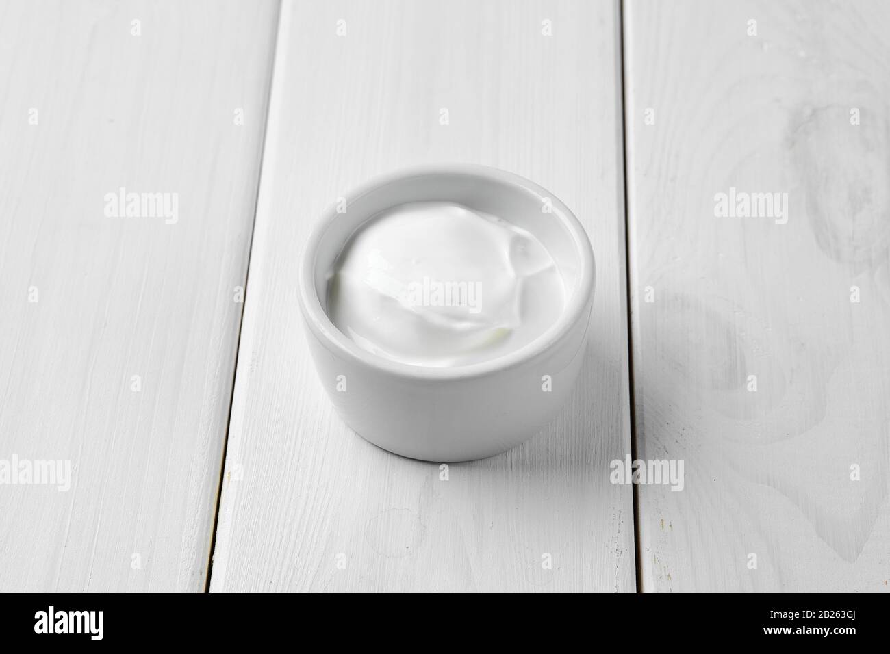 Sour cream in ceramic gravy boat Stock Photo Alamy