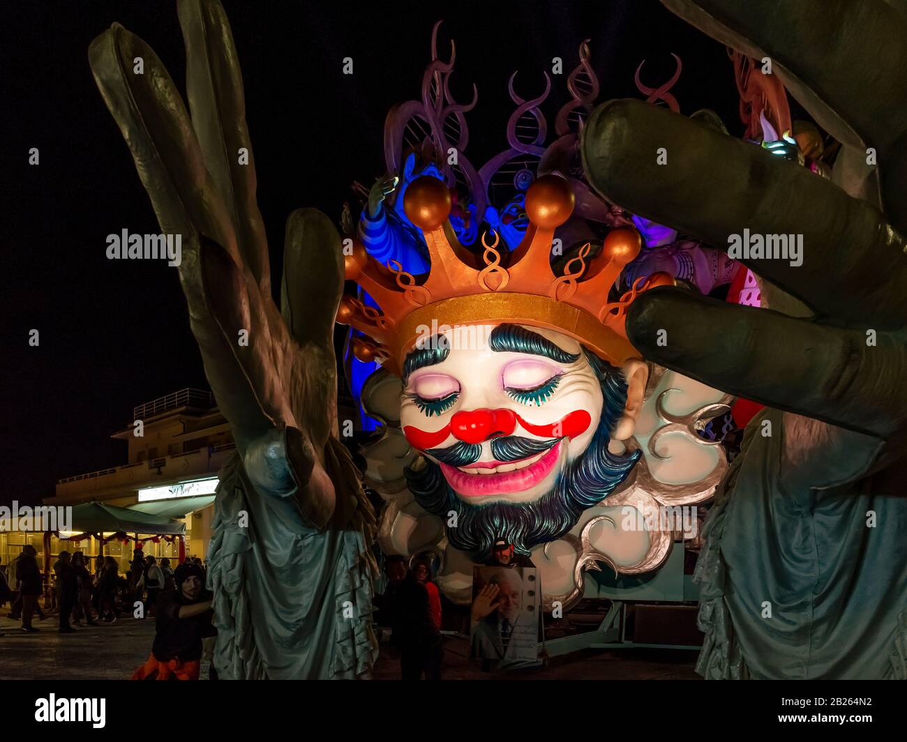 The allegorical float entitled 'Abbracciami è Carnevale' during the night parade in Viareggio, Italy Stock Photo
