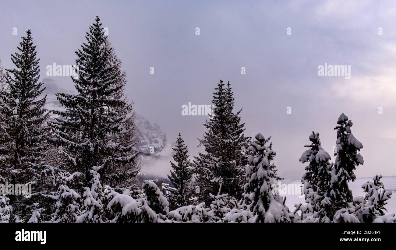 Clouds carrying snow in the italian alps Stock Photo - Alamy