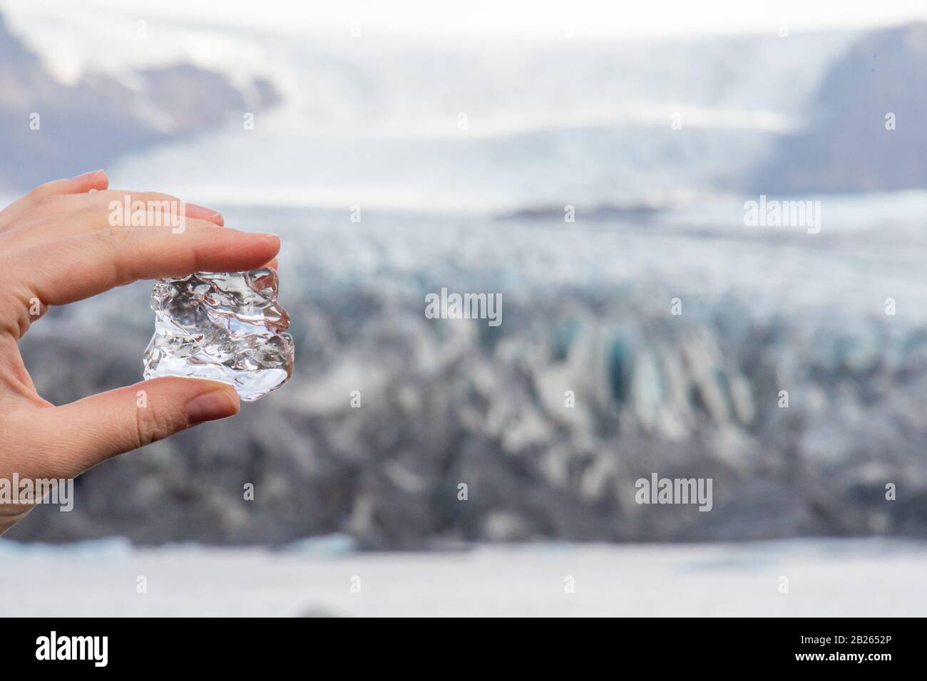 Vatnajoekull glacier in Iceland ice of the glacier between fingers in front of the deep blue ice crevice Stock Photo
