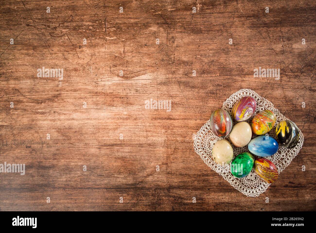 Some Easter eggs in a group on the wooden background. Stock Photo