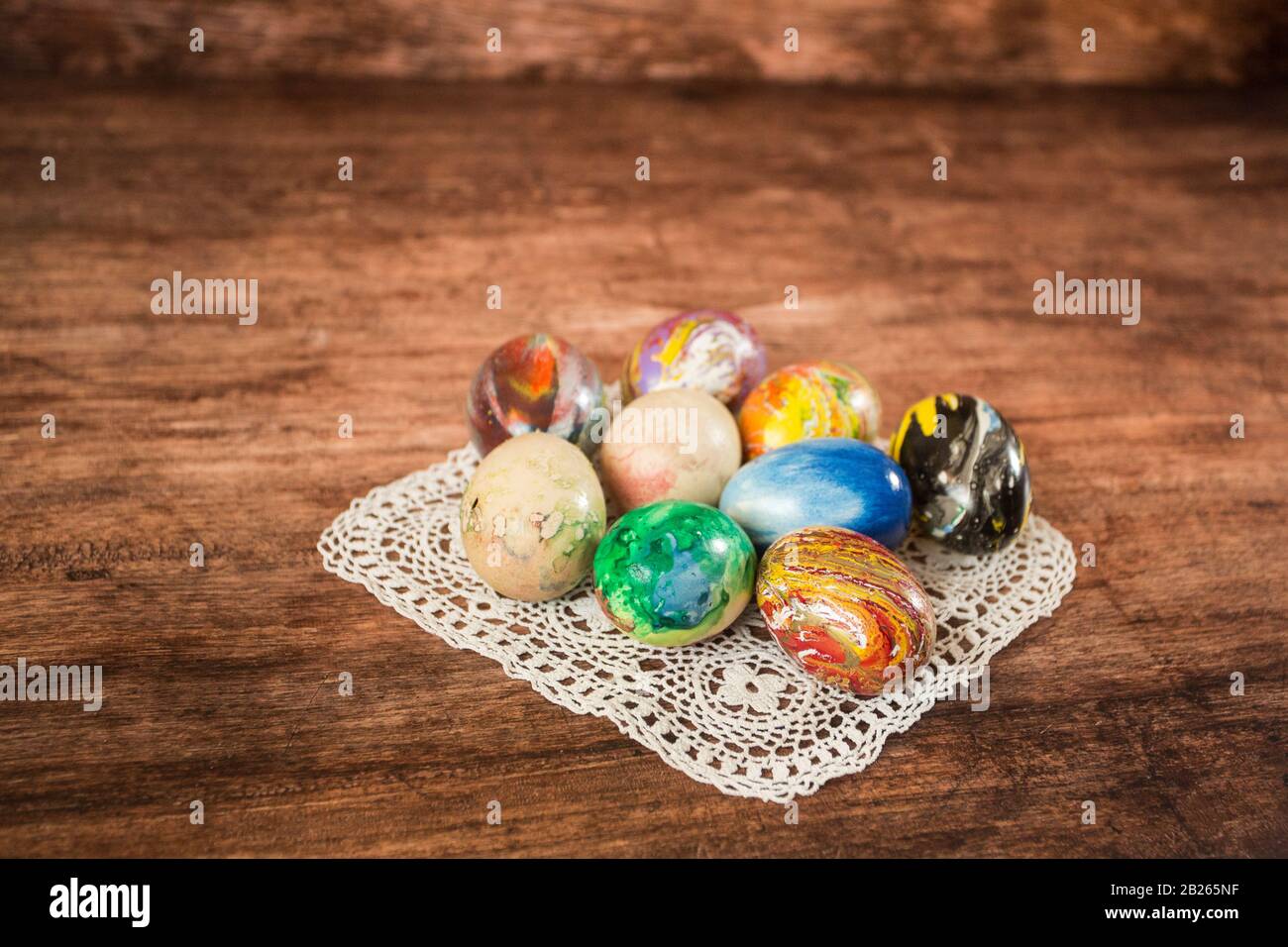 Some Easter eggs in a group on the wooden background. Stock Photo