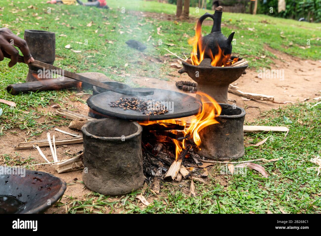 Roasting of coffee beans on a flat pan in a village in southern Ethiopia Stock Photo