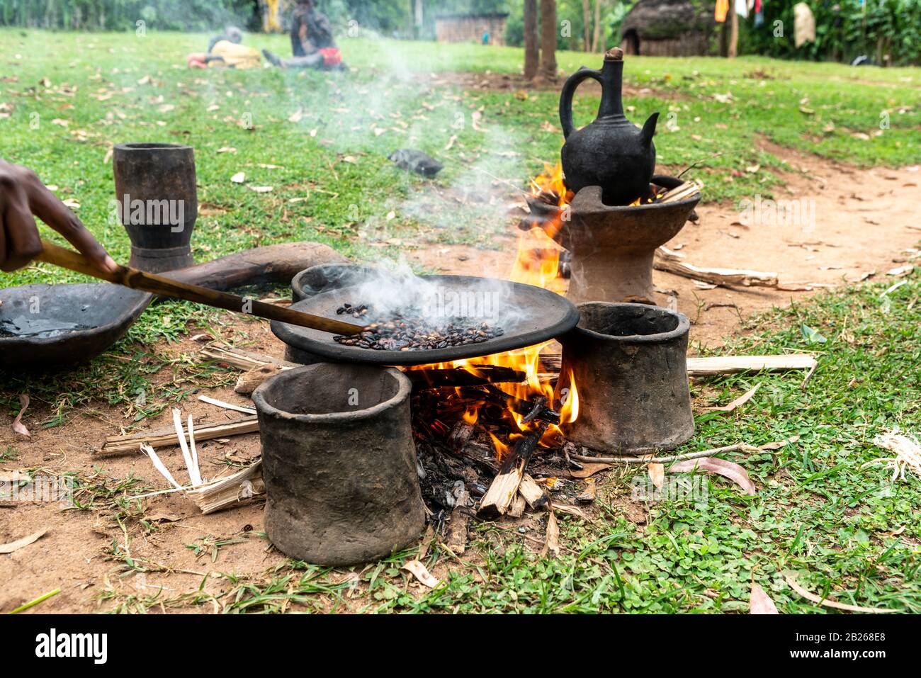 Roasting of coffee beans on a flat pan in a village in southern Ethiopia Stock Photo