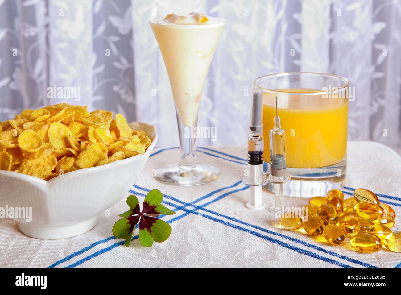 Healthy anti swine flu breakfast with vitamins, flu vaccines and a lucky clover Stock Photo