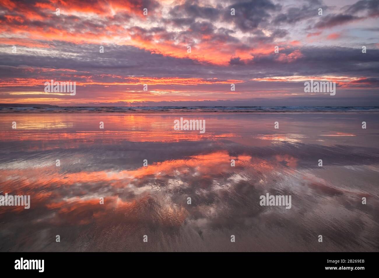 Romantic sunset over the North Devon beach, coast, coastal, sand, sea, coastal living, lifestyle, South West, shoreline, stunning, dramatic, UK Stock Photo