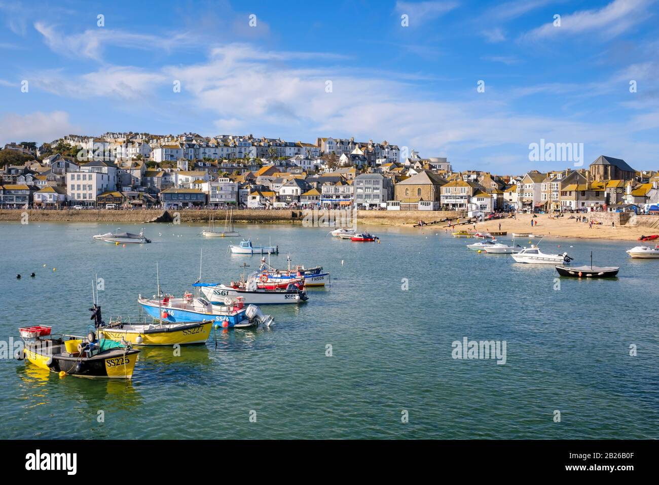 Views across St Ives Harbour to St Ives village and Smeatons Pier with boats in the Harbour, Cornwall, South West, UK Stock Photo