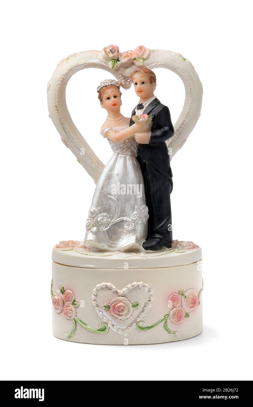 Bride and groom, vintage cake topper isolated on white background Stock Photo