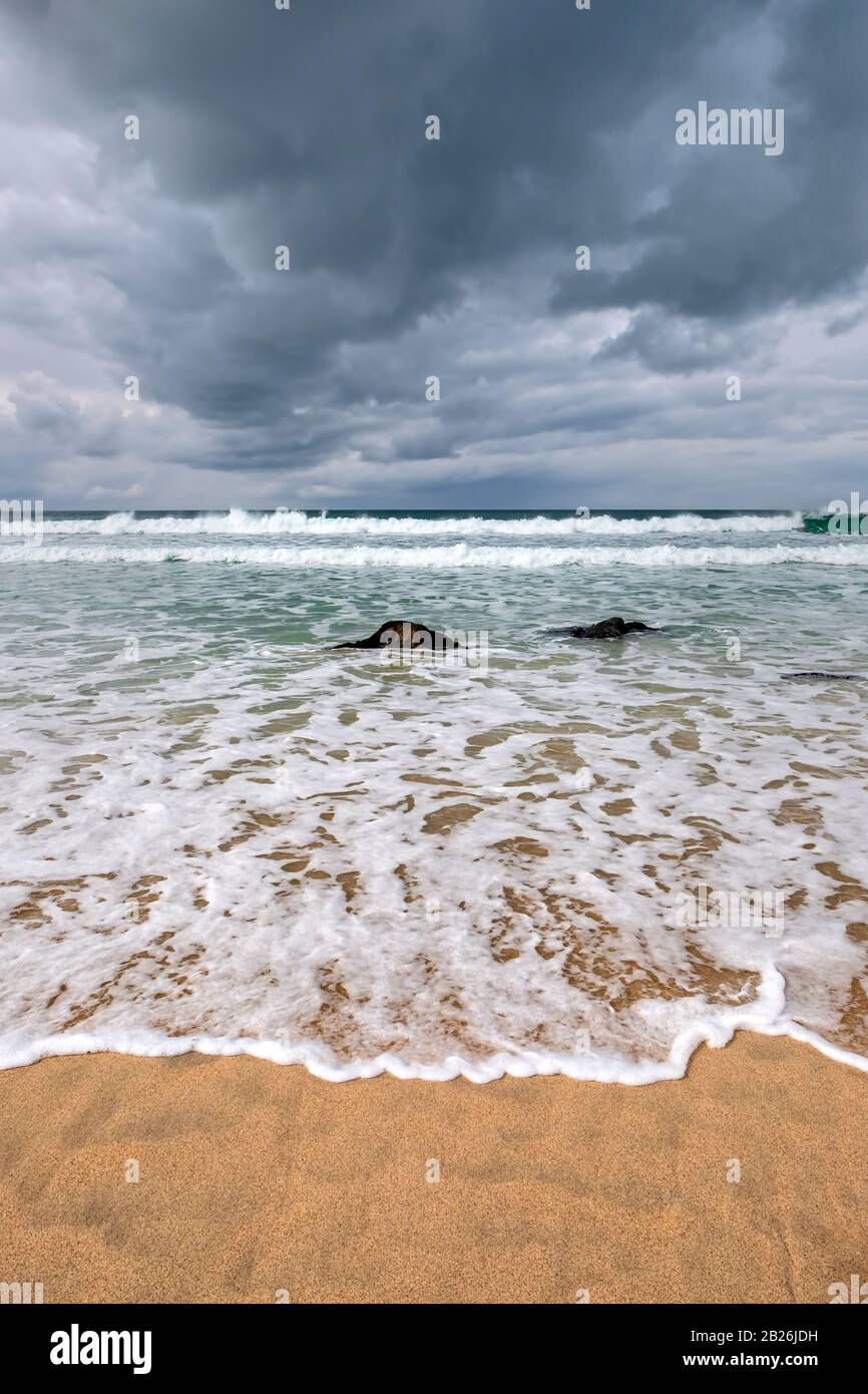 Porthmeor beach St Ives, Cornwall, surfing beach, artistic Cornwall, Cornwall colours, sea, sand, rocks, surfing, holiday destination, Uk travel, Stock Photo