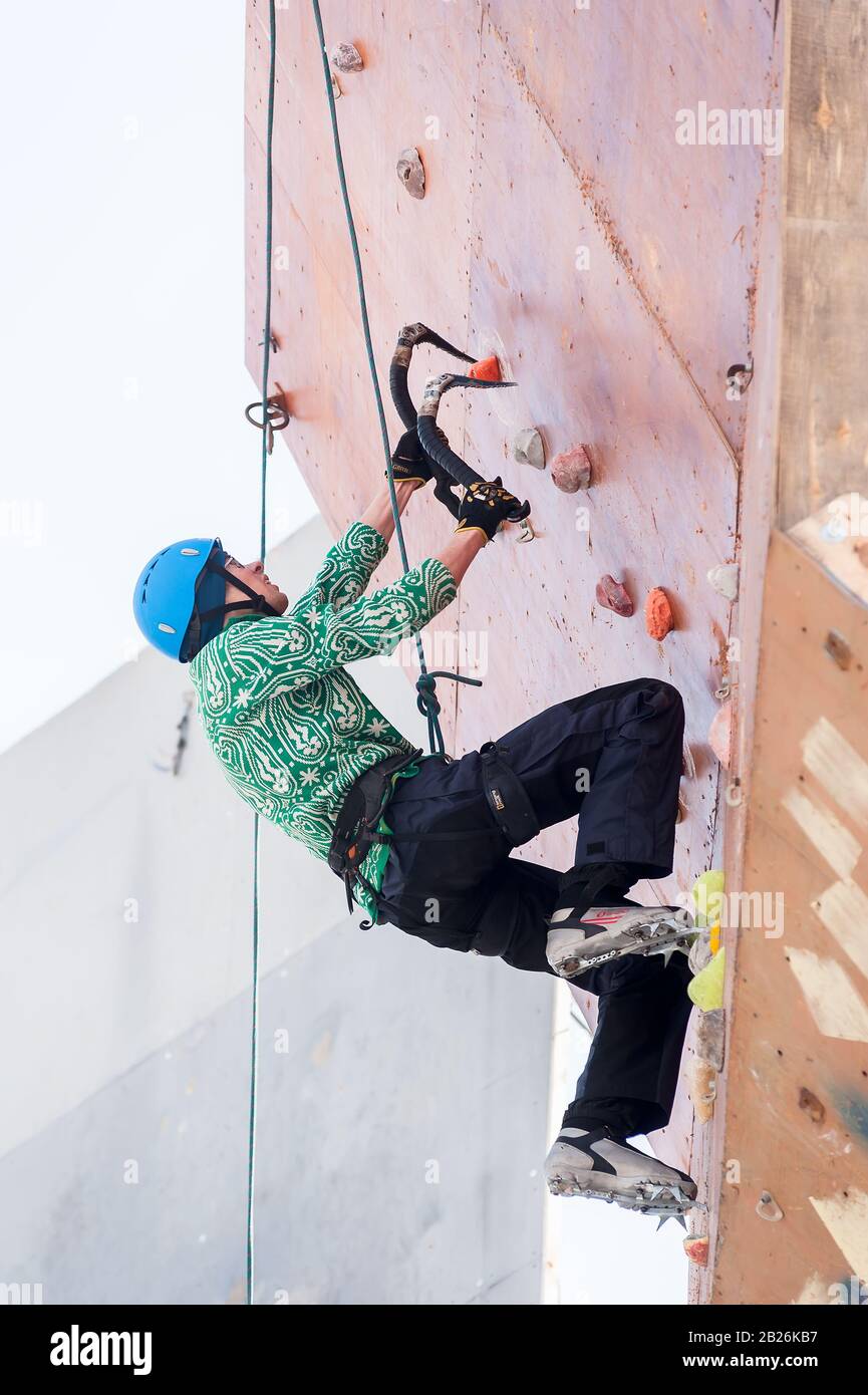 Alone man climbing rope hi-res stock photography and images - Alamy