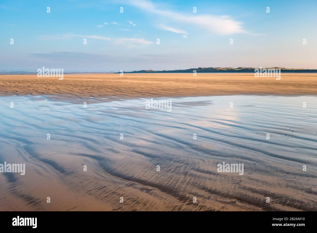 Wet sea beach early sunset hi-res stock photography and images - Alamy