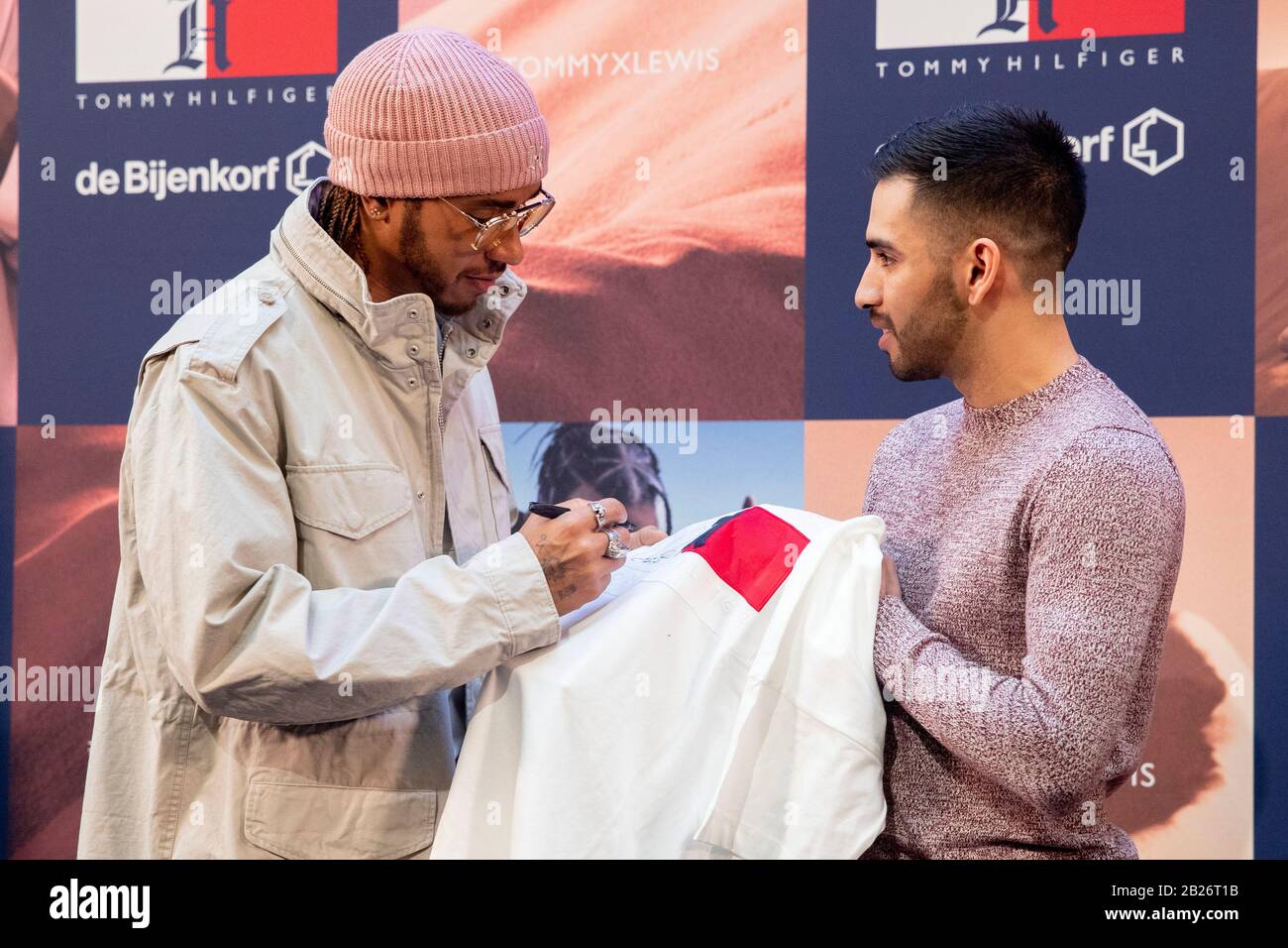 Amsterdam, Netherlands. 20th May, 2019. Lewis Hamilton signs a shirt of Tommy  Hilfiger for a fan during the launch party of TommyXLewis at the Dutch  warehouse De Bijenkorf, Amsterdam. Credit: SOPA Images