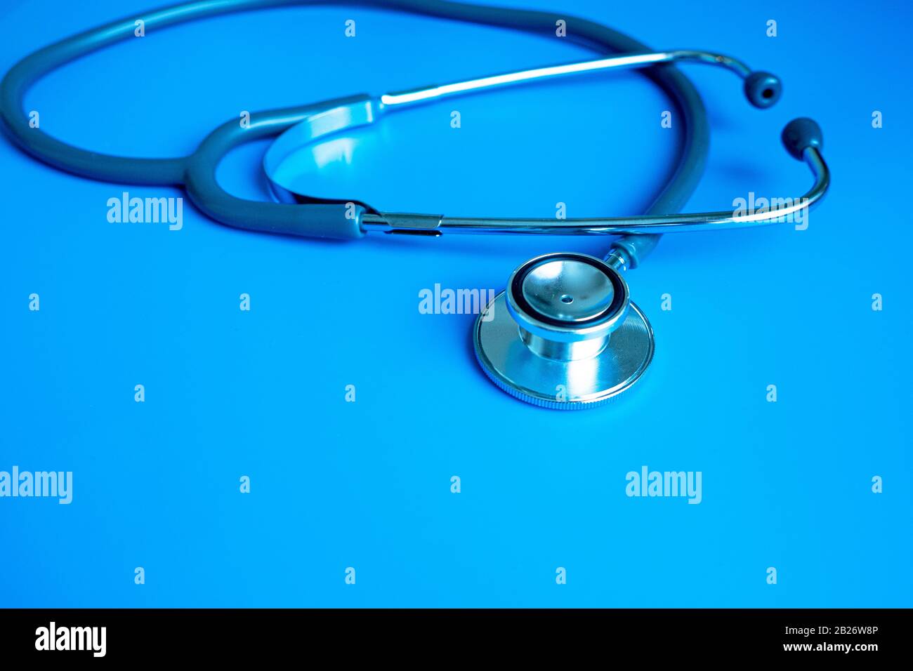 Coronavirus concept. Medical stethoscope on a blue background, copy space Stock Photo