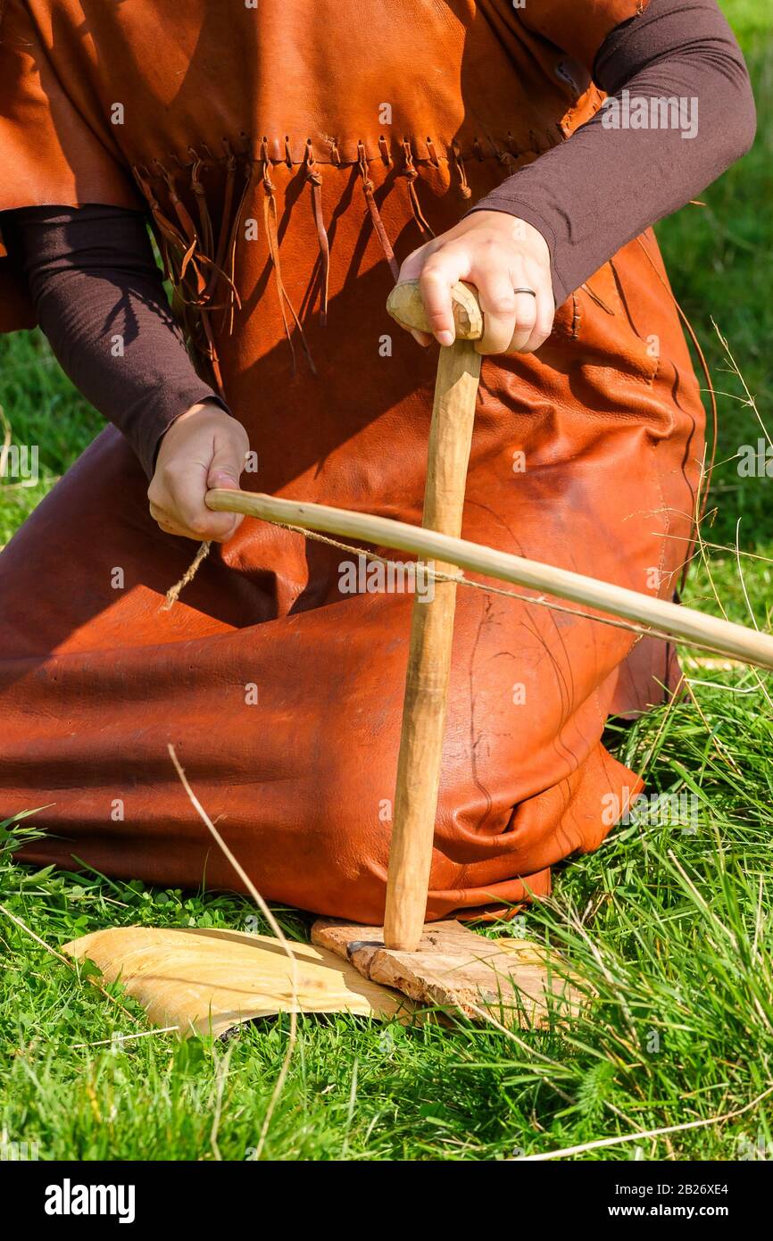 Make a fire with a bow drill Stock Photo