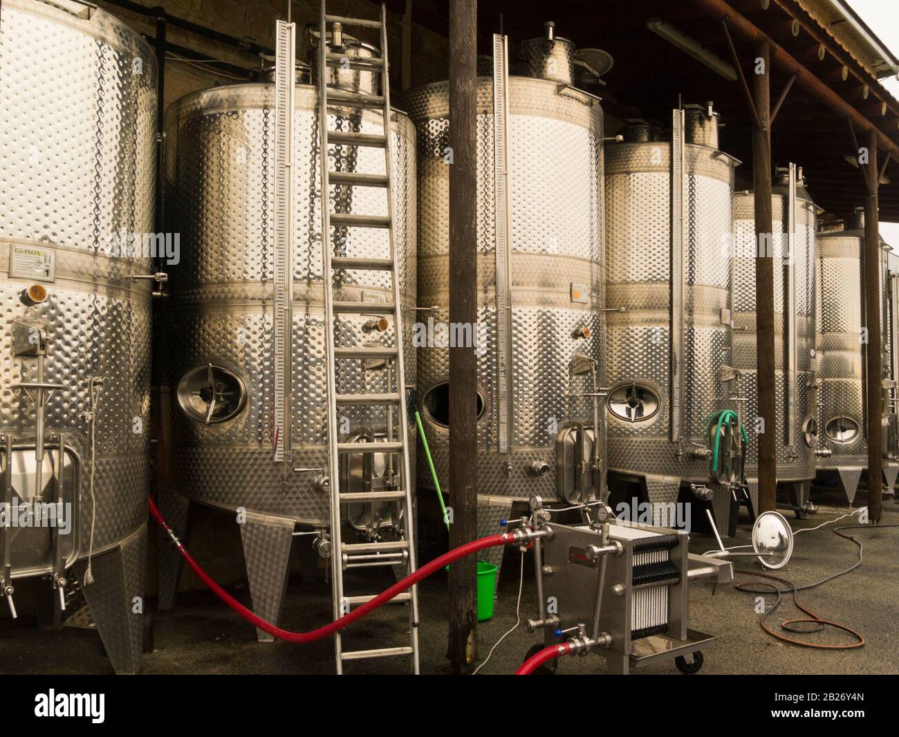 Stainless steel vats containing fermenting wine in Ktima Gerolemo winery Omodos Cyprus producer of award winning red white rose and sweet white and re Stock Photo