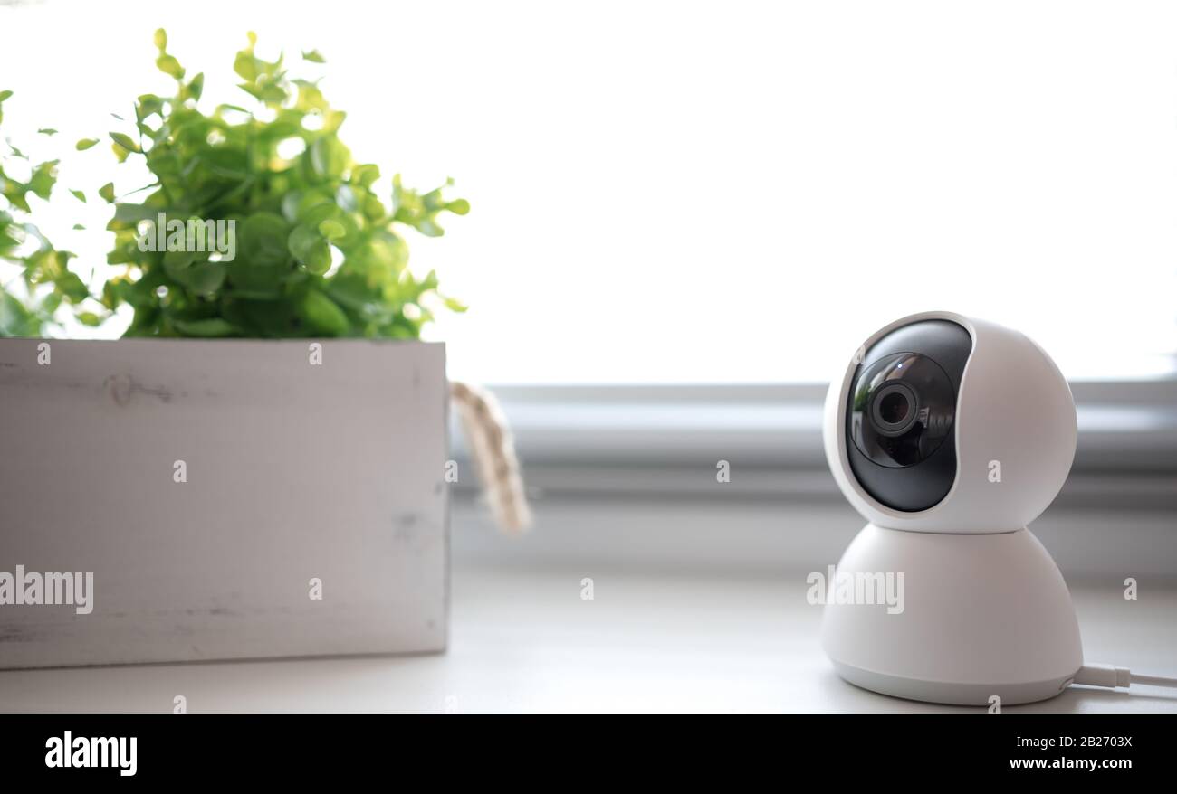 Indoor CCTV wireless IP security camera with 360 degrees rotating head, Concept of home security system for surveillance and protection Stock Photo