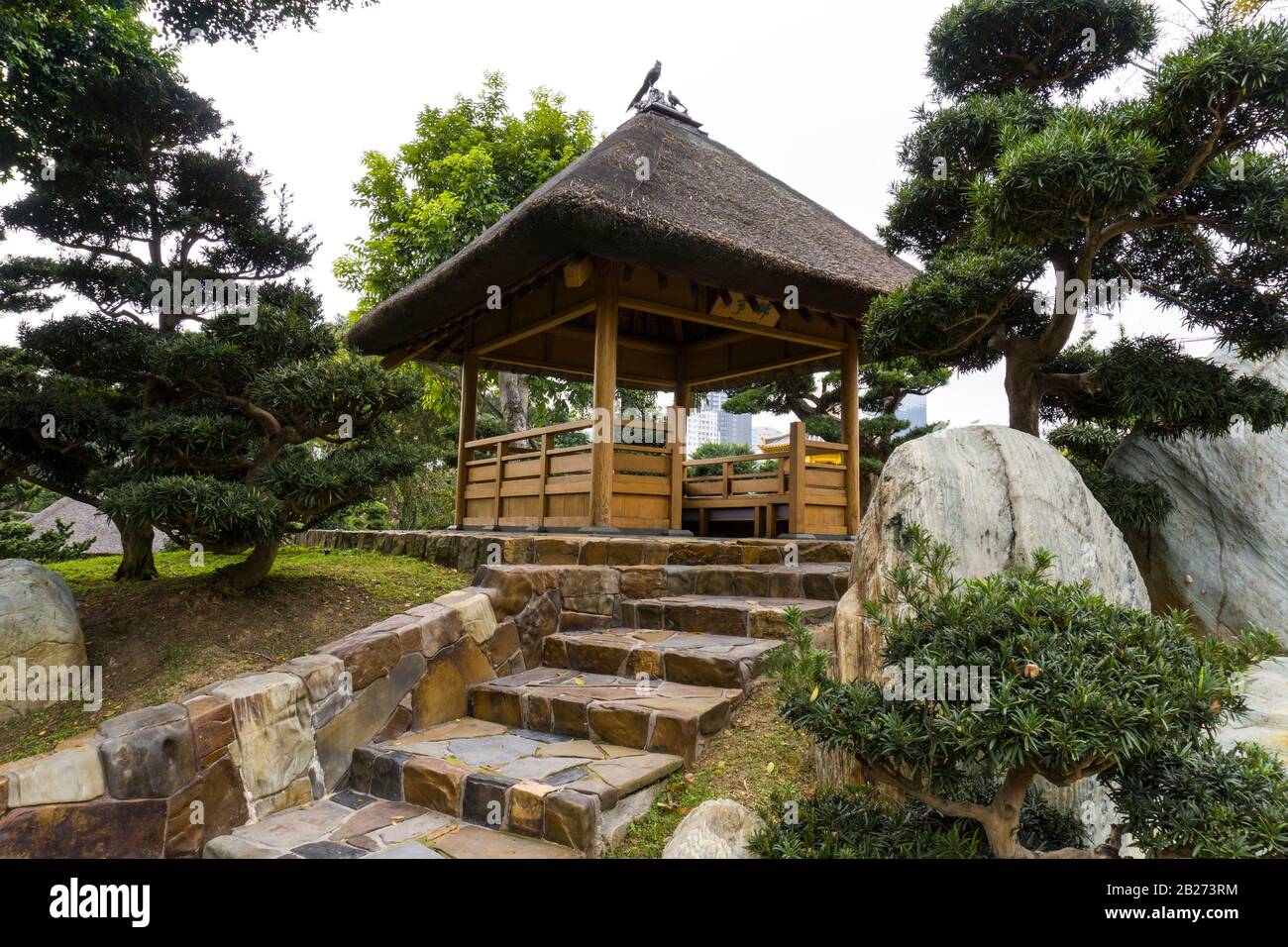 Hong Kong - January 18 2020 : Wooden Chinese Pavilion at Nan Lian Garden, Diamond Hill, Kowloon, Medium Shot, Low Angle View Stock Photo