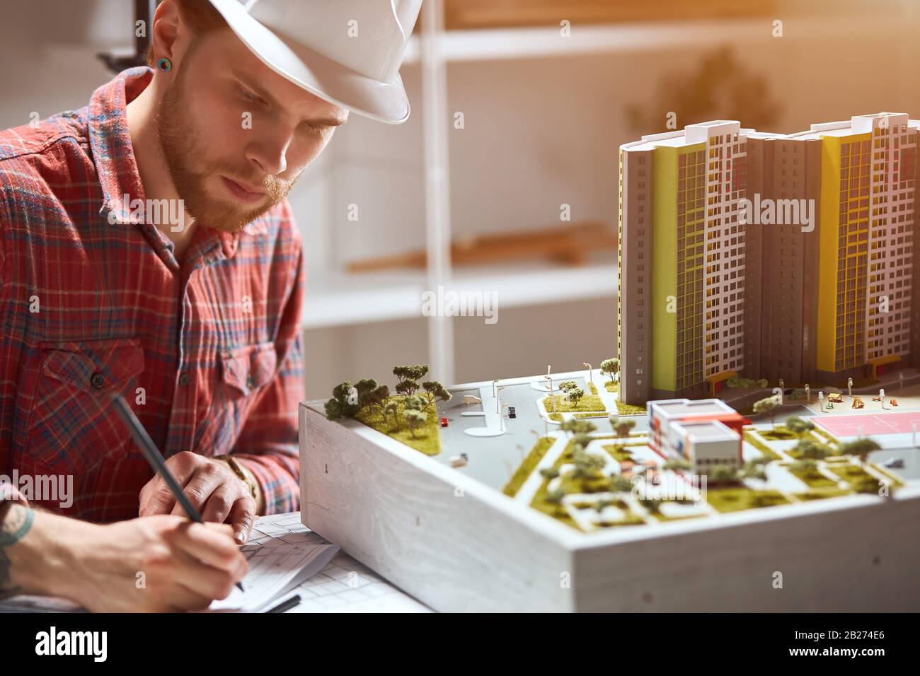 talented young architect sketching a construction project. close up photo. Stock Photo