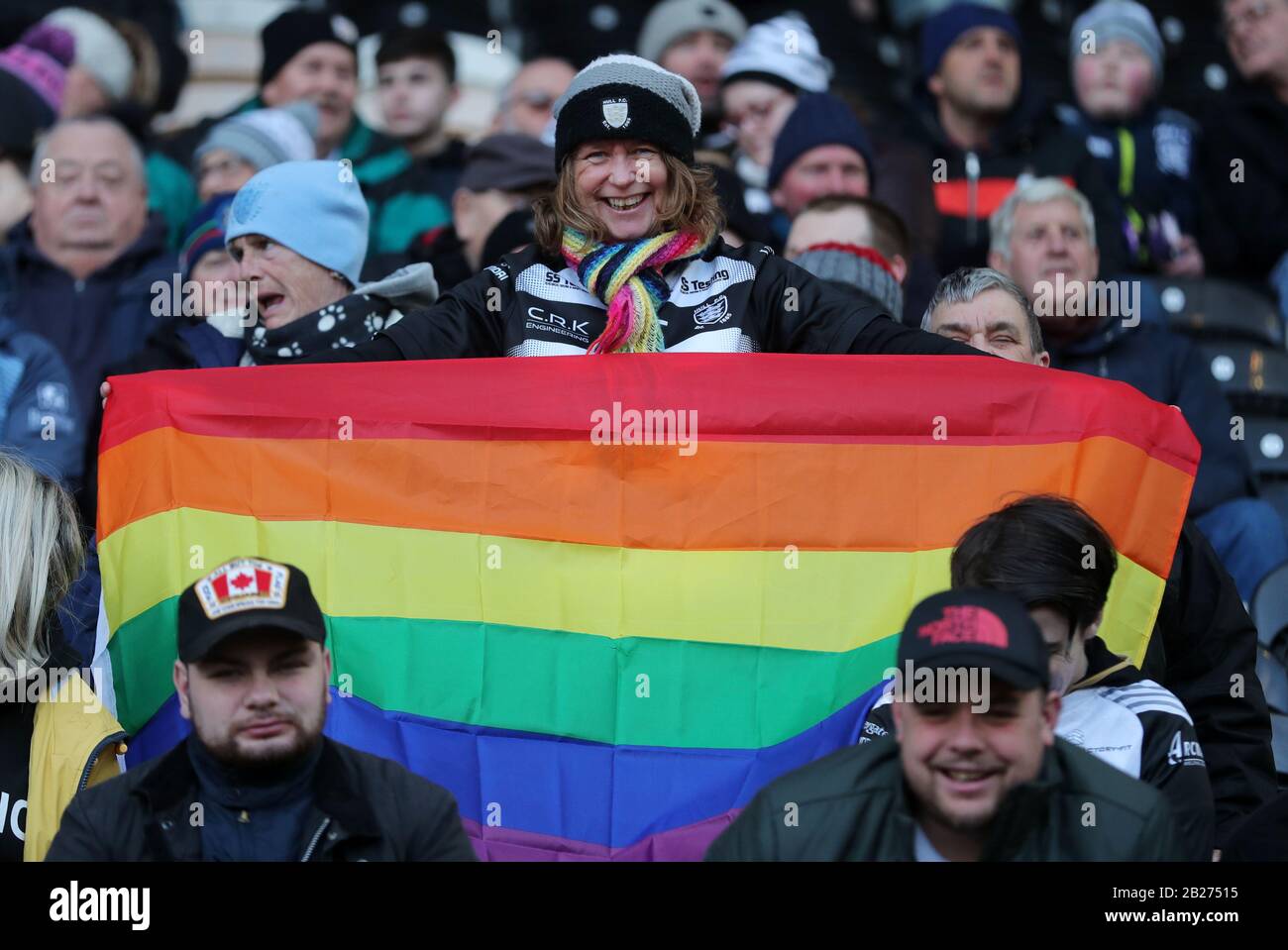 A fan holds up a rainbow flag during the Super League match at the KCOM Stadium, Hull. Stock Photo