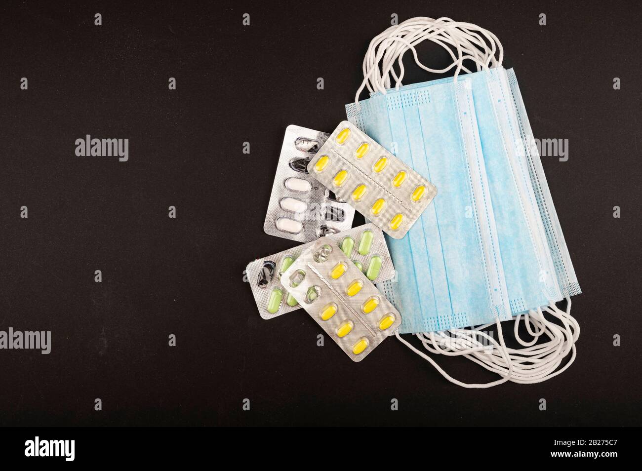 Mask Tablet Disposable medical masks and packages of different tablets on a white ...
