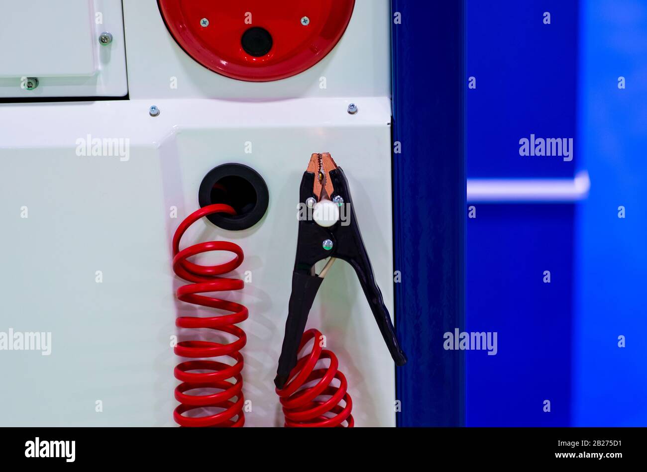 Close up battery jumper cables for charging dead battery in factory