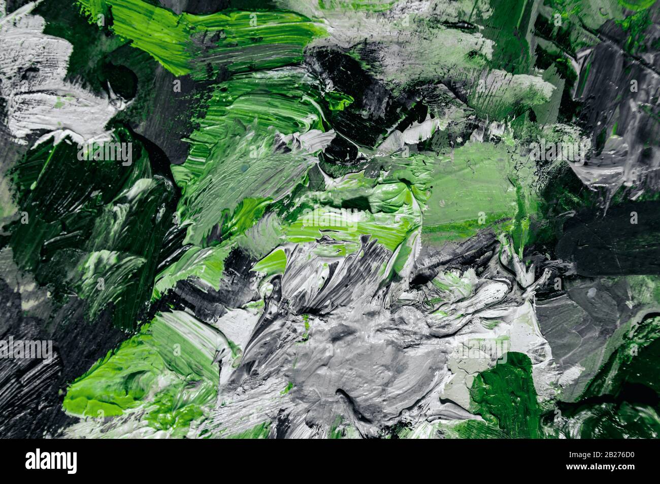 black and white with green contrasting background of oil paints