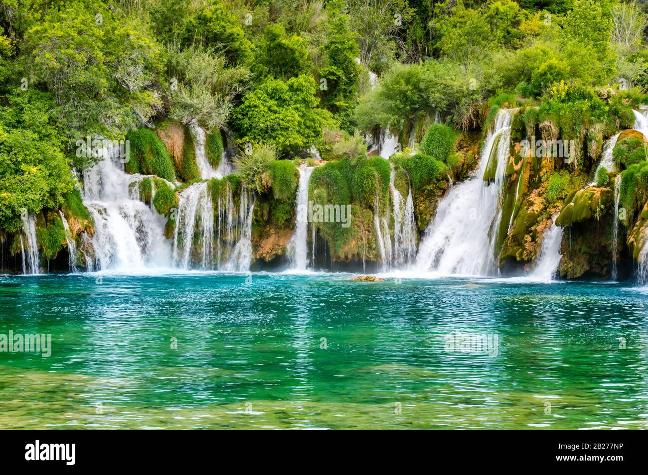 Beautiful Krka Waterfalls in Krka National Park, Croatia. Skradinski buk is the longest waterfall on the Krka River with clear turquoise water and den Stock Photo
