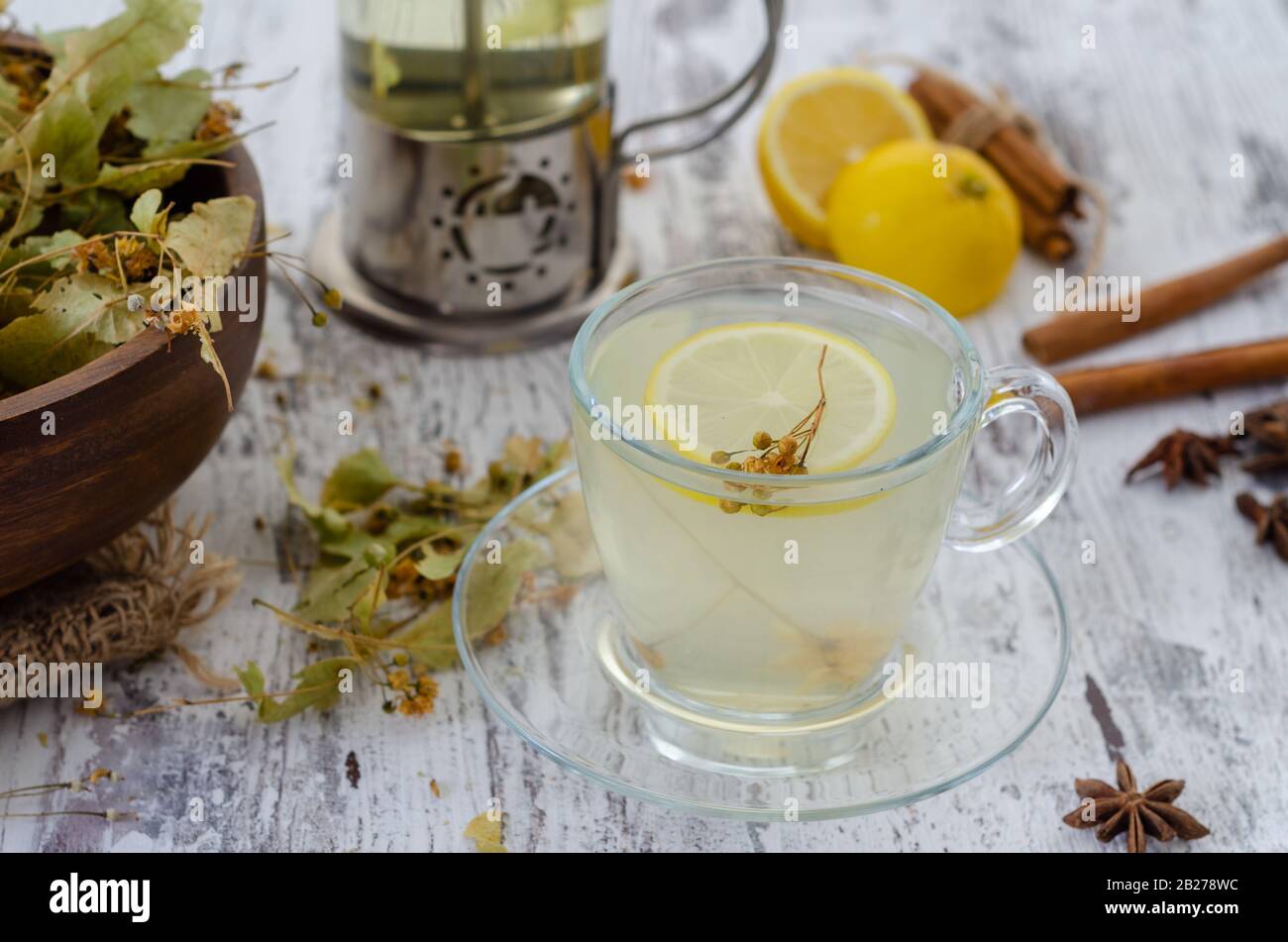 Linden and linden tea. Herbal tea made from linden. Detox herbal tea on wooden table. Stock Photo