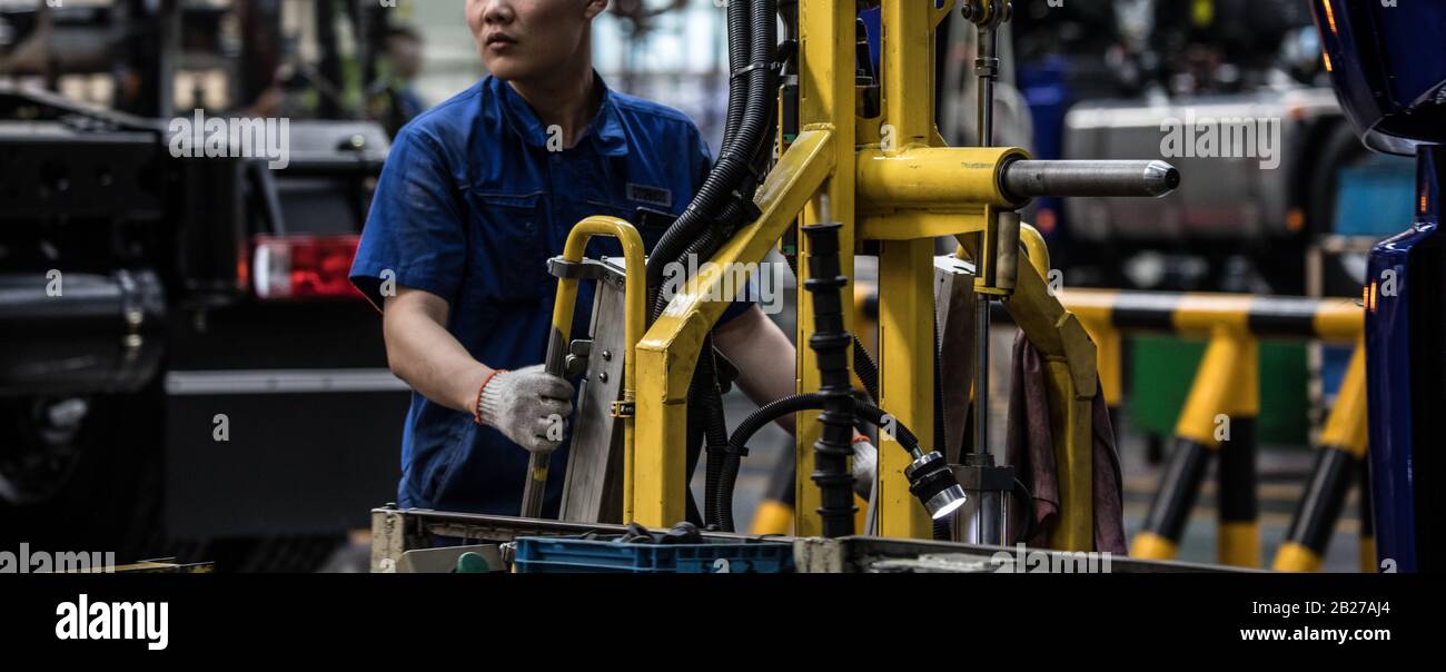 Workers in machinery factory in China Stock Photo Alamy