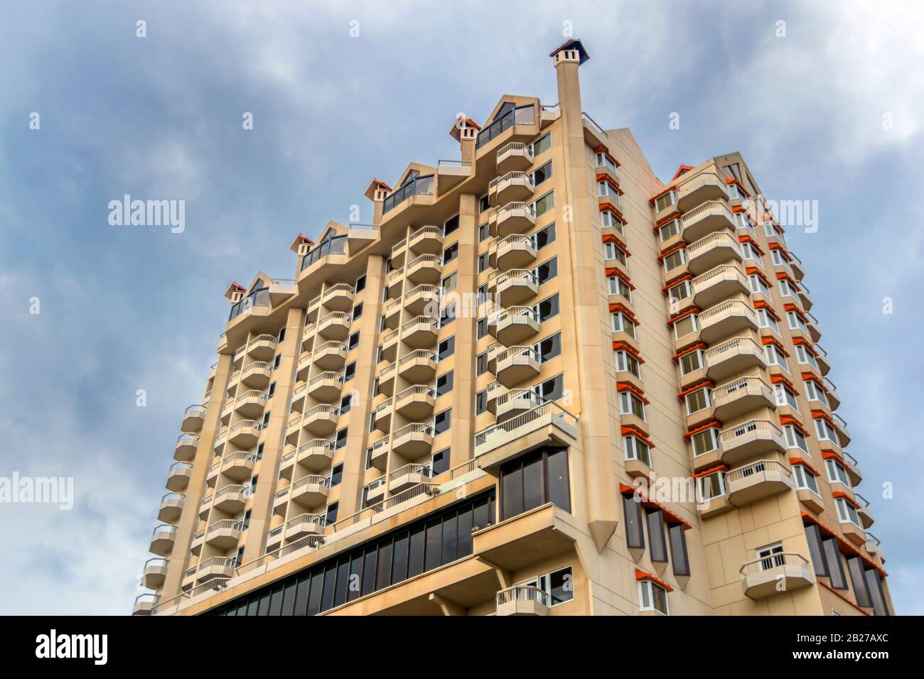 High rise hotel looking up from below on the balcony side Stock Photo ...