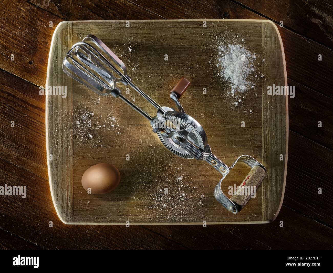 Artistic still life of hand mixer and egg Stock Photo