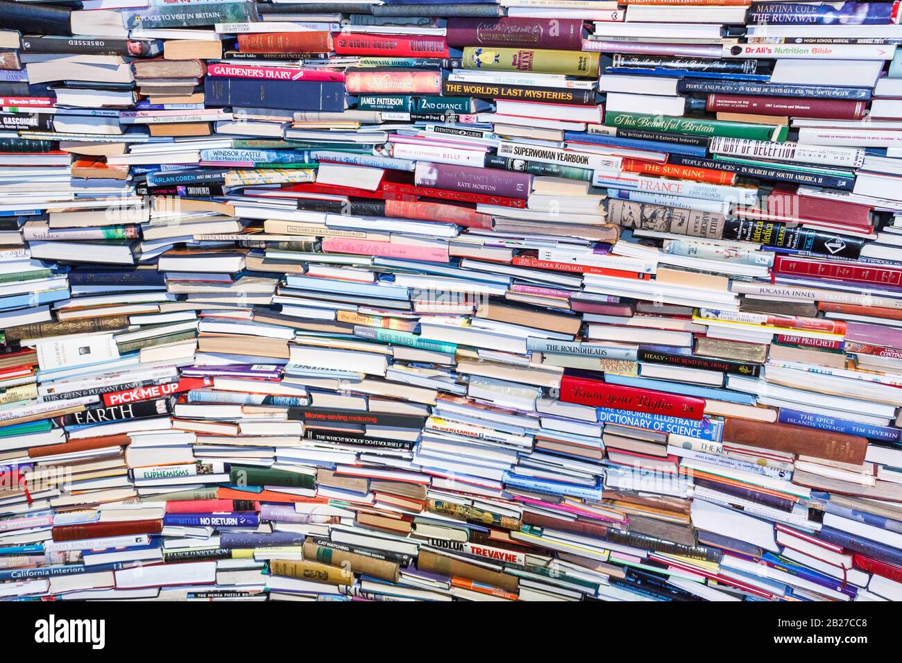 A large stack of books lying horizontally Stock Photo - Alamy