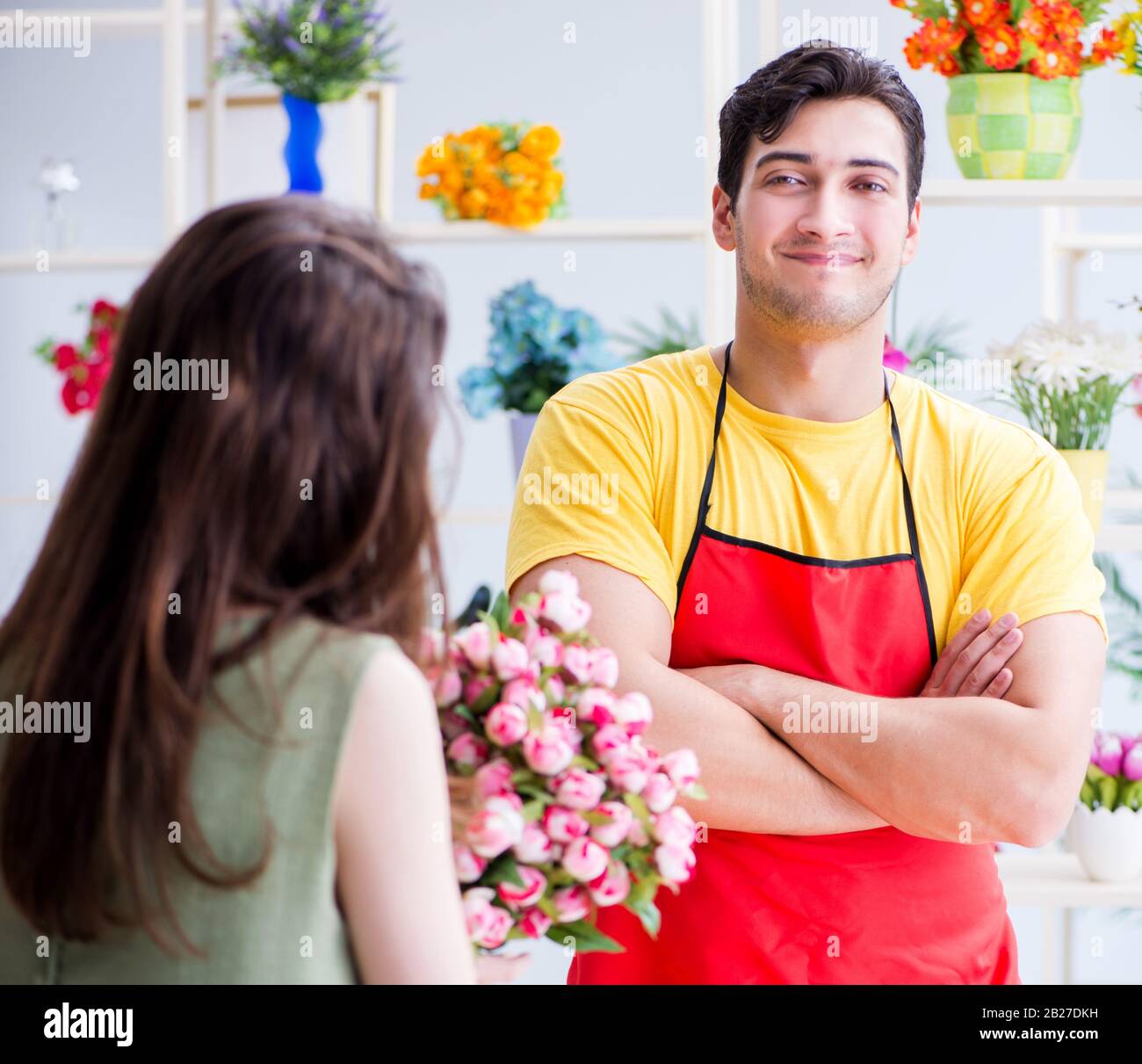 The florist selling flowers in a flower shop Stock Photo Alamy