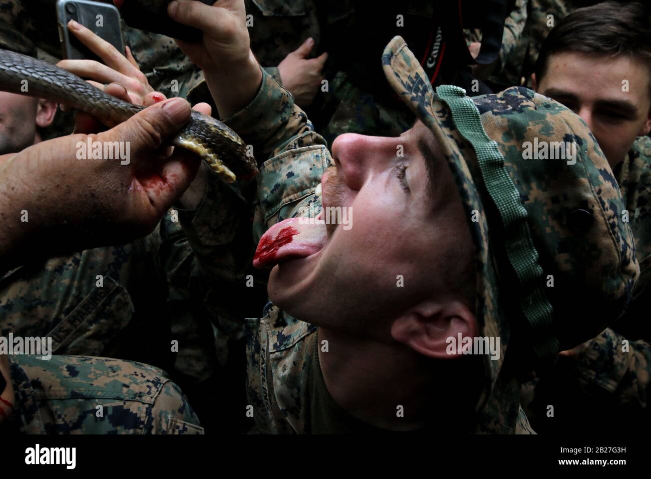 Chanthaburi, Thailand. 1st Mar, 2020. US Marines drink cobra's blood offered by a Thai Navy during a jungle survival training as part of the military exercise Cobra Gold 2020 at a Navy base in Chanthaburi province. March 01, 2020. The 39th annual Cobra Gold military exercise is an event held between the Thai and US armed forces every year. It's the largest Asia-Pacific military exercise held each year, and is among the largest multinational military exercises in which the US participates. Credit: Urdee Image/ZUMA Wire/Alamy Live News Stock Photo