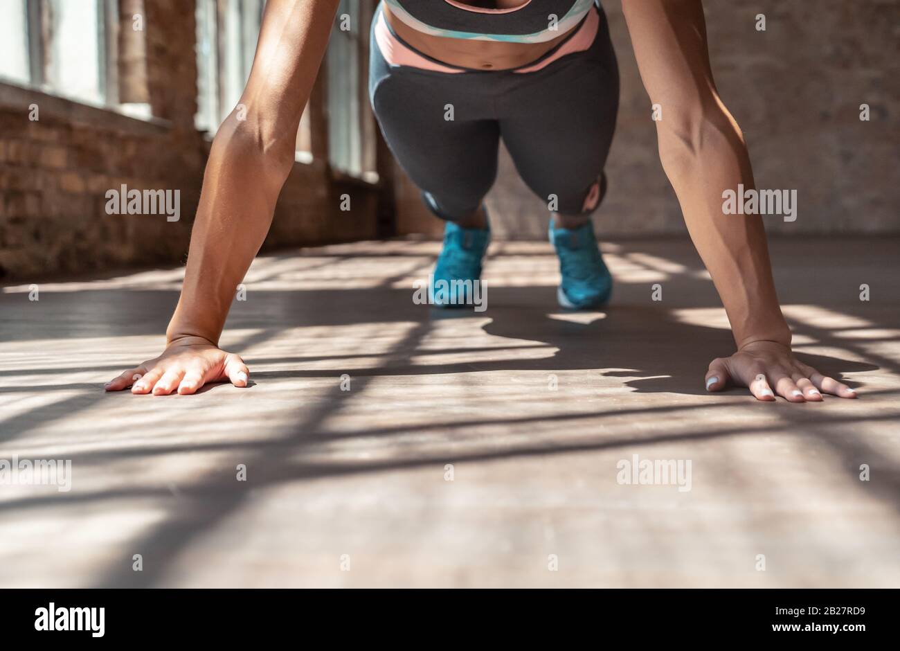 Closeup young sporty woman practice hatha yoga plank pose healthy lifestyle. Stock Photo