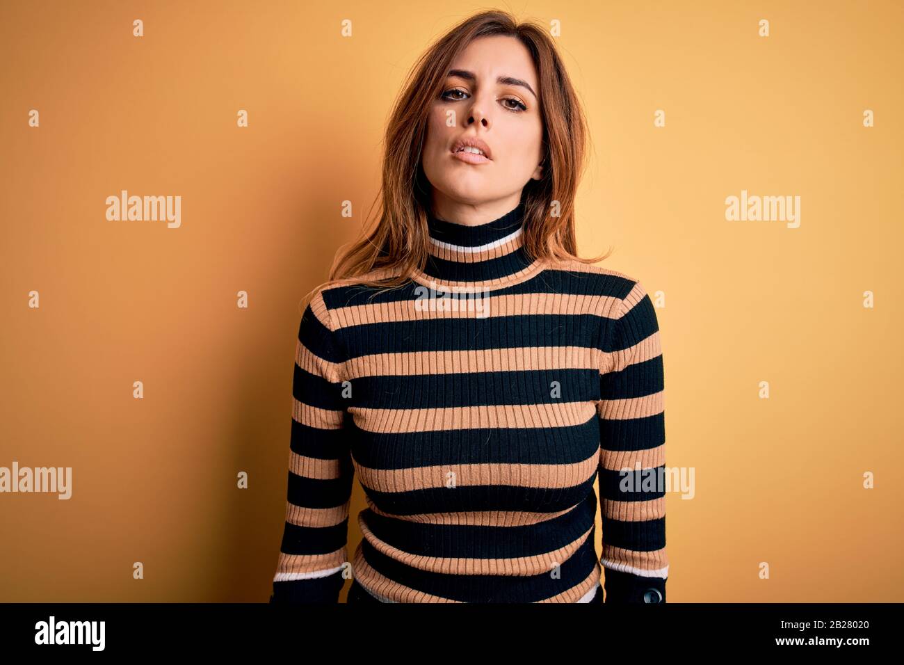 wearing striped turtleneck sweater over 