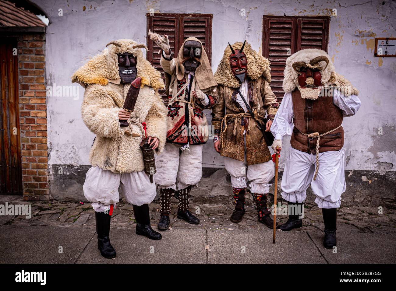 Four men dressed in "buso" costume during the annual buso festivities in Mohacs, Southern Hungary Stock Photo