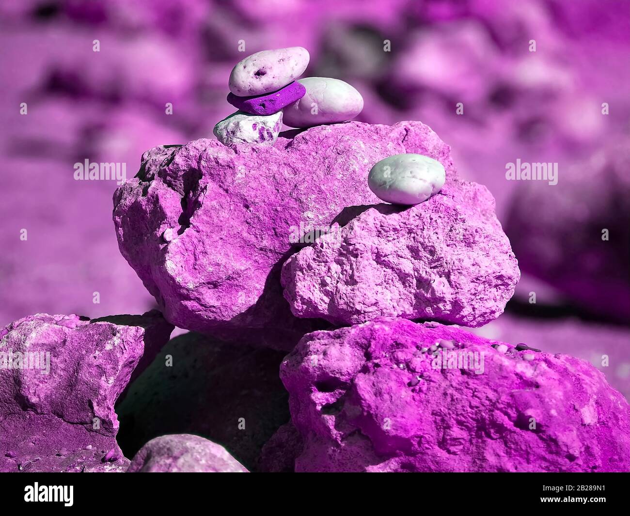 Stack of stones for balance and harmony in bright colors Stock Photo