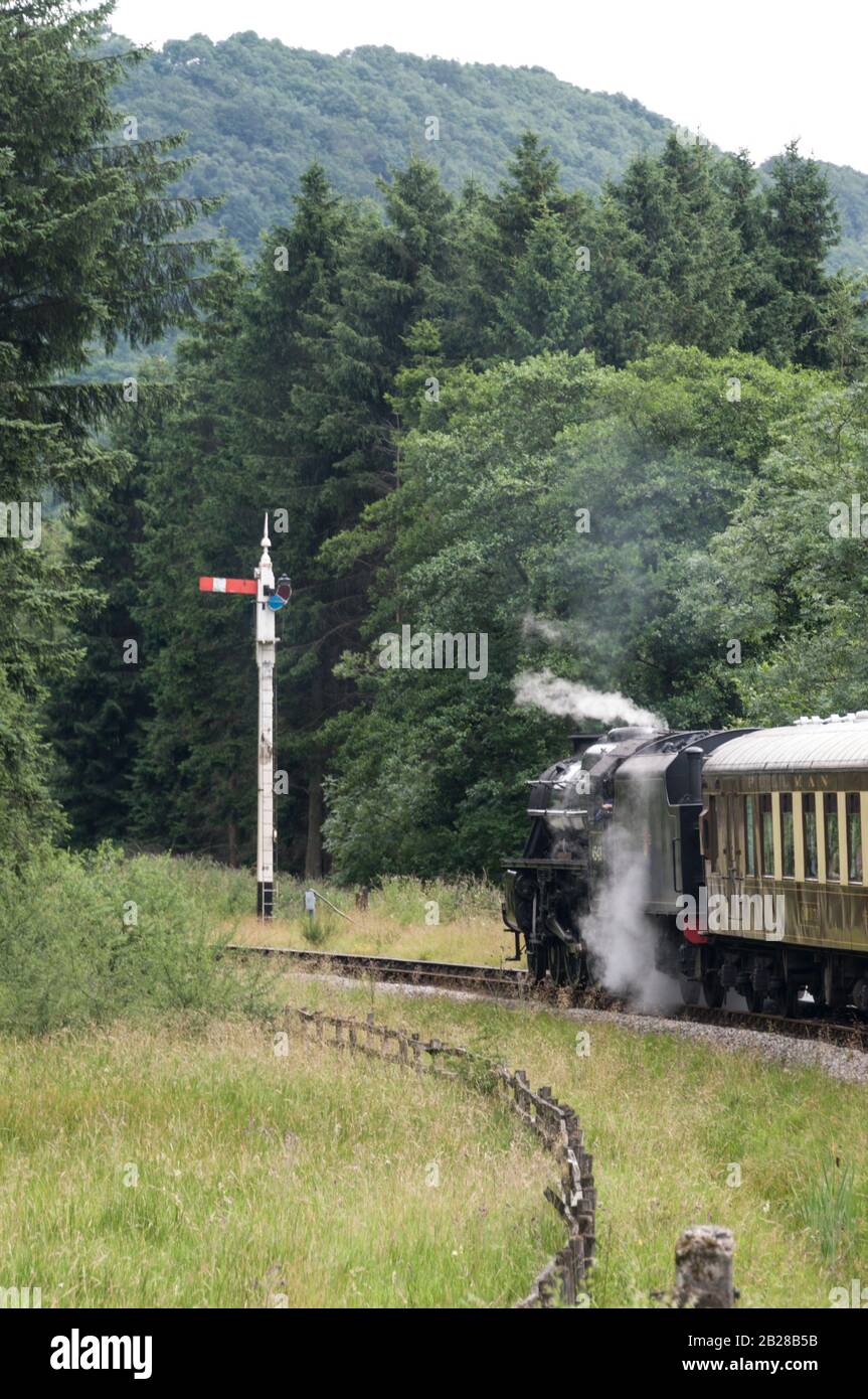 A passenger steam train of the North Yorkshire Moors railway heading for Pickering railway station on the North York Moors, in Britain.  The steam loc Stock Photo