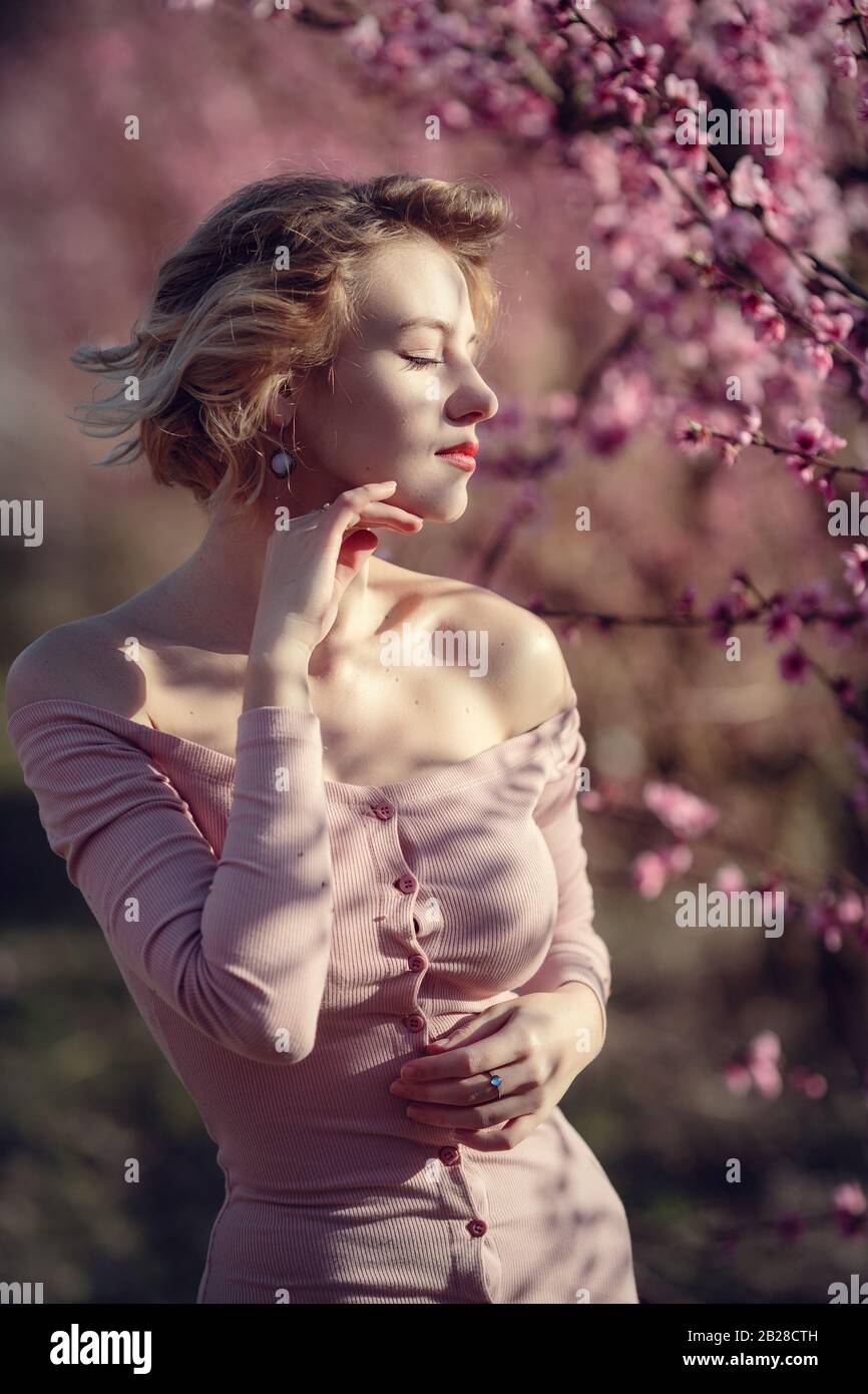 fashion outdoor photo of gorgeous young woman in elegant dress posing ...